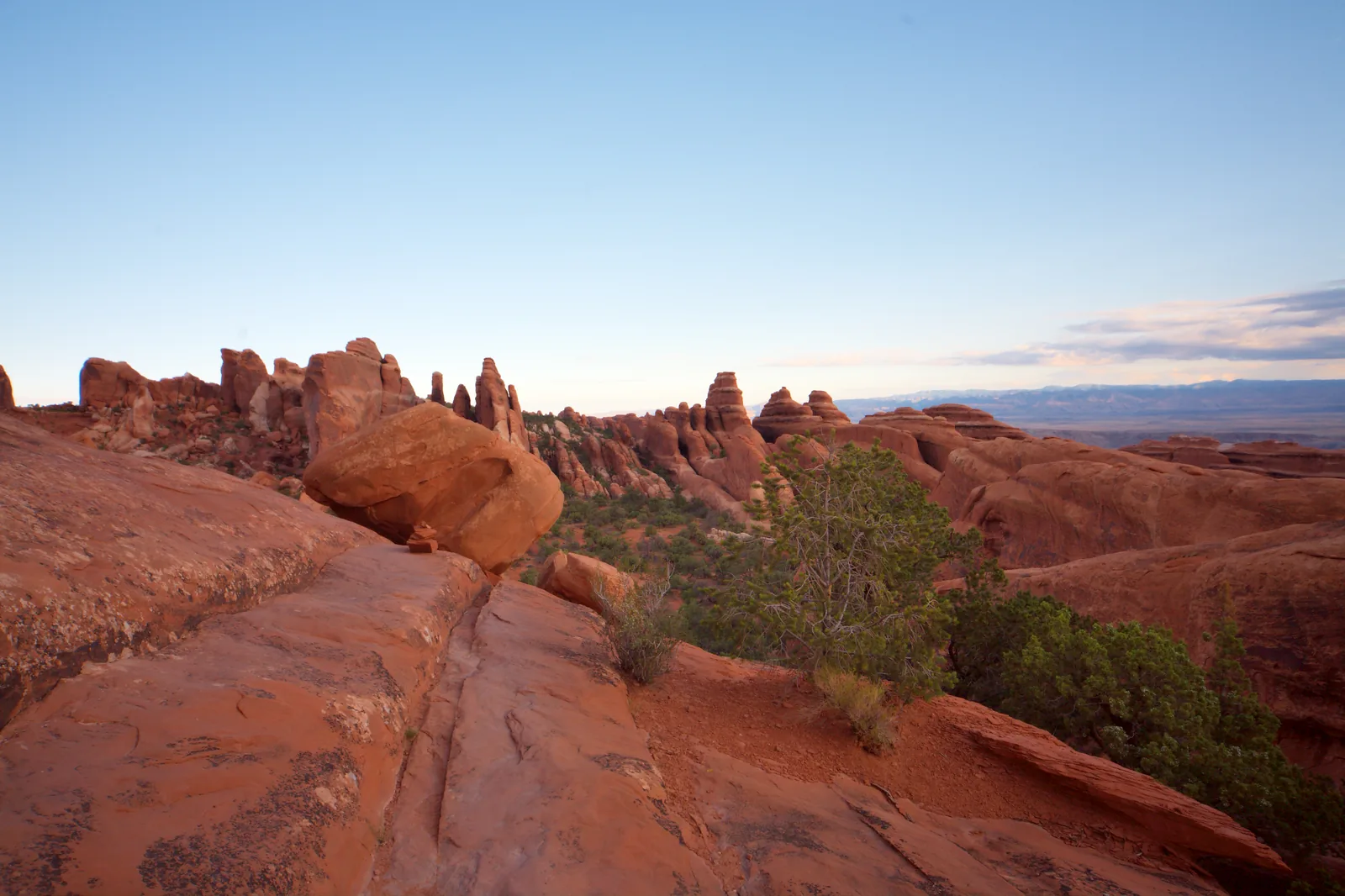 Narrow red rock fins and bare sandstone in Arches National Park, along the primitive trail to Double O Arch