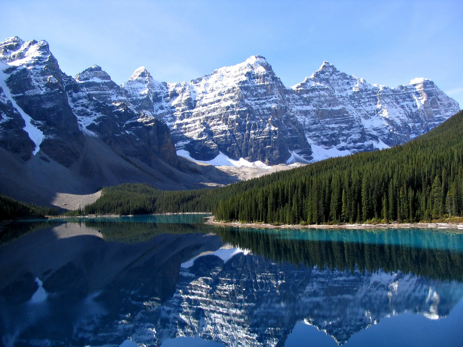 The Ten Peaks in Banff National Park reflected in the smooth water of Moraine Lake.