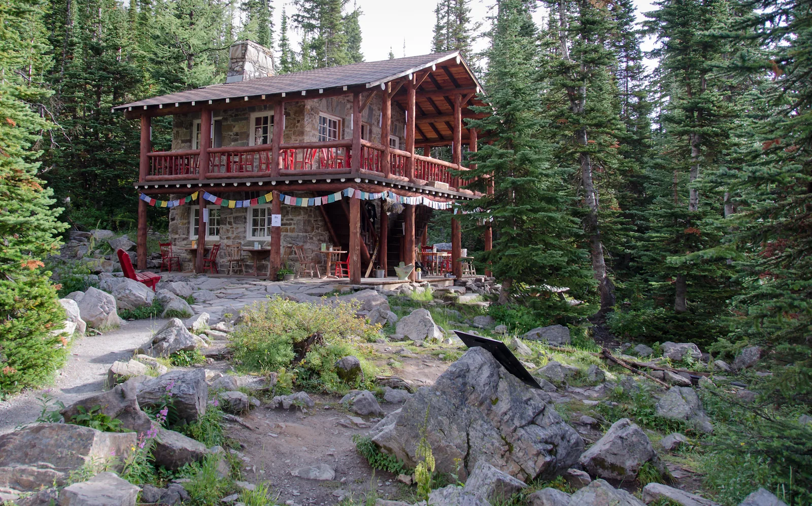 The wooden teahouse in Banff National Park at the Plain of Six Glaciers among conifers.