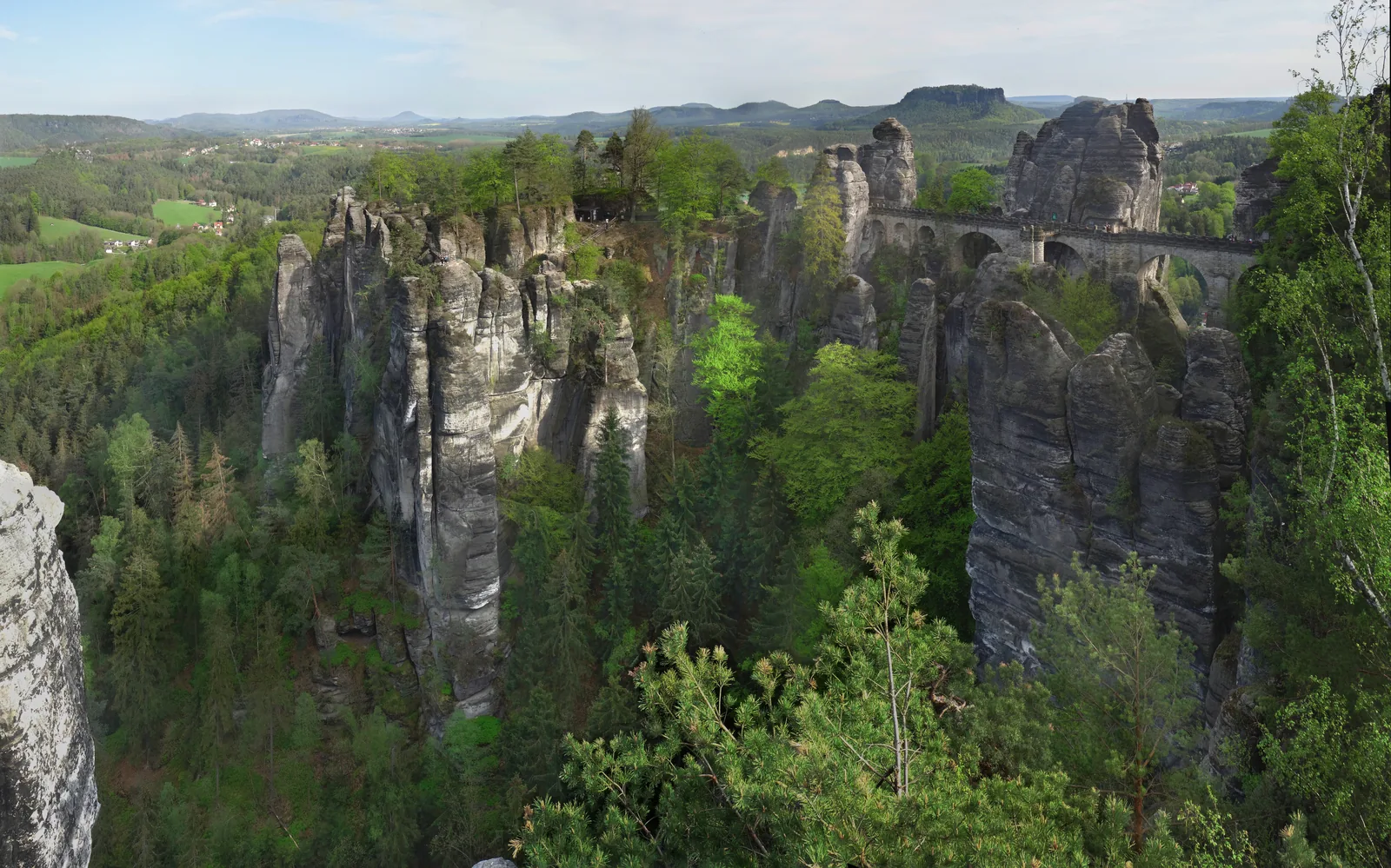 The Bastei Bridge in Saxon Switzerland National Park between the sandstone rocks, next to it the Neurathen rock castle, seen from the Ferdinandstein