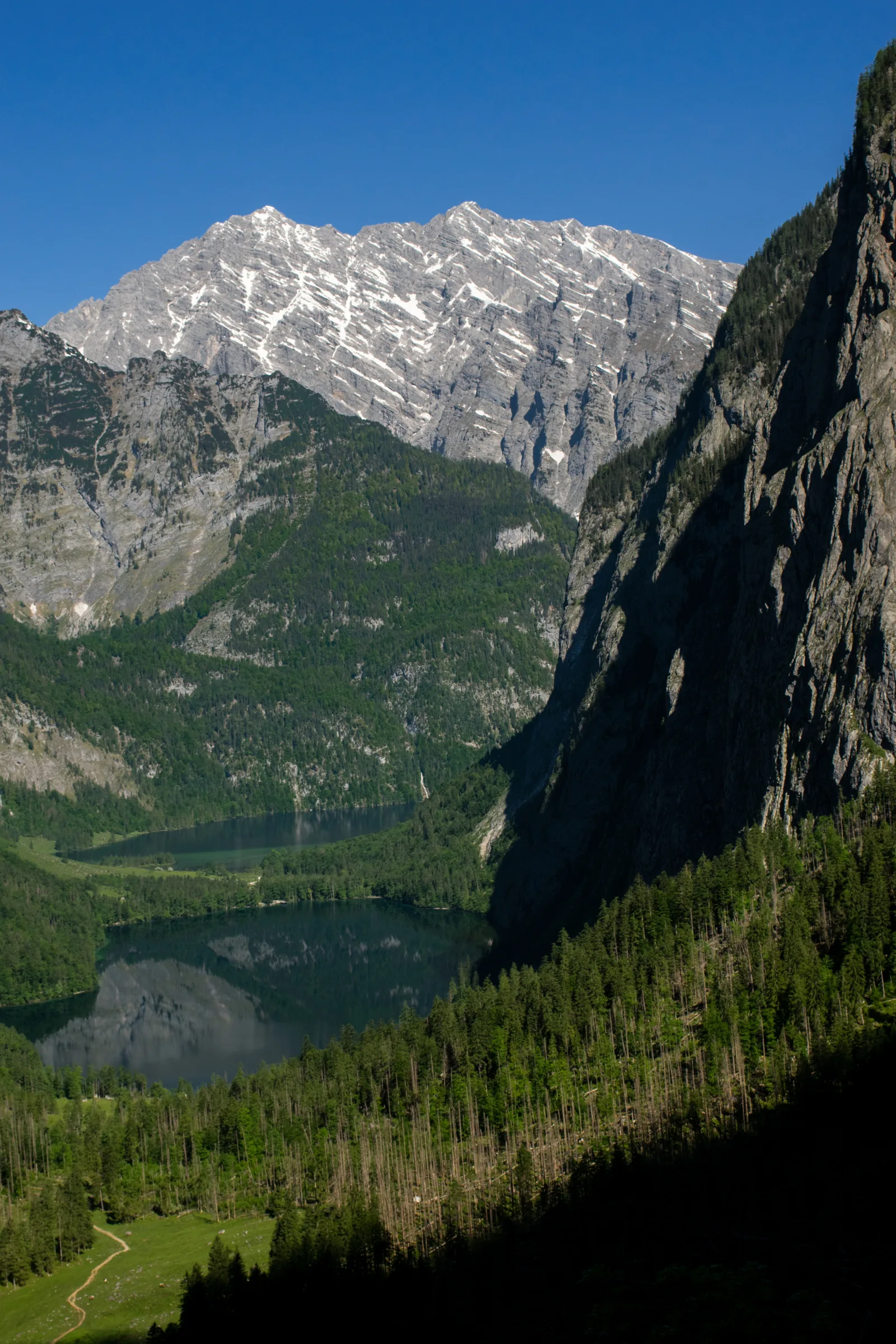Obersee and Lake Königssee in Berchtesgaden National Park, below the Watzmann East Face, photographed from the Röthsteig trail at the Röthbach waterfall