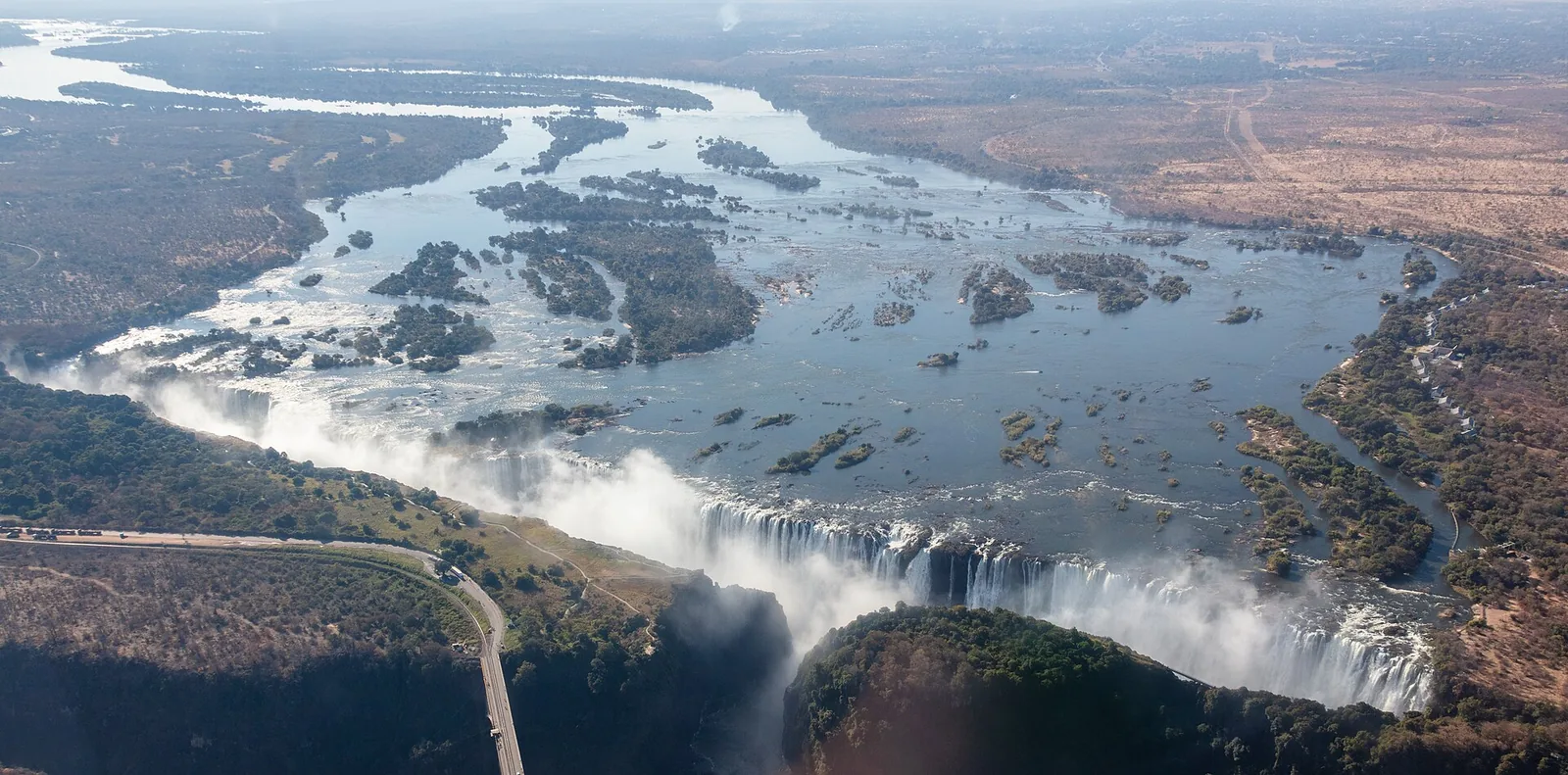 Aerial view of Victoria Falls with Livingstone Island on the edge, where Devil's Pool lies, and the Zambezi and its islands behind