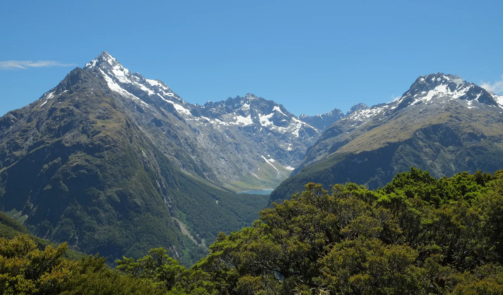 View from Key Summit in Fiordland National Park of snow-capped Mount Christina and the valley towards Lake Marian