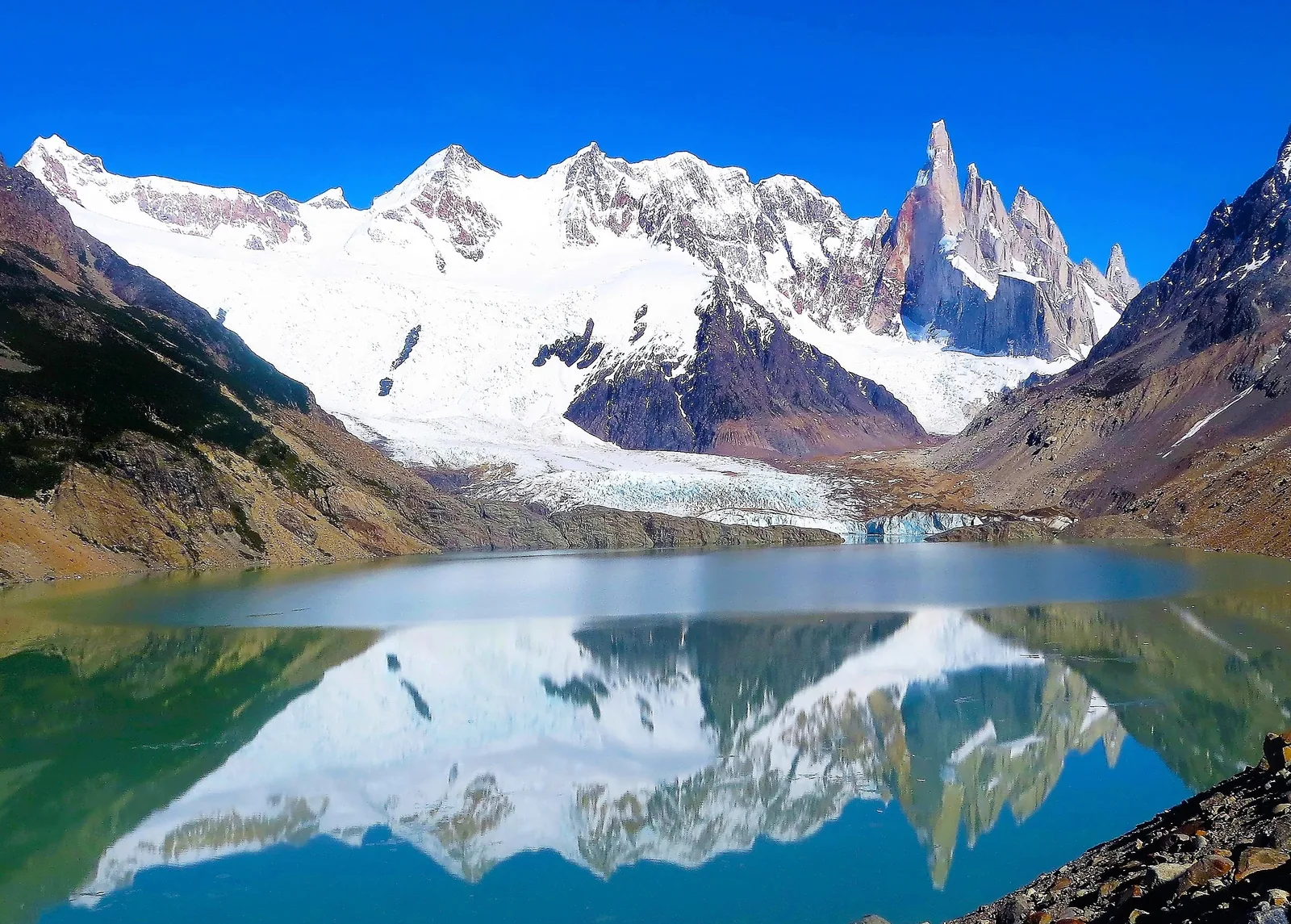 Cerro Adela and Cerro Torre in Los Glaciares National Park reflected in calm Laguna Torre