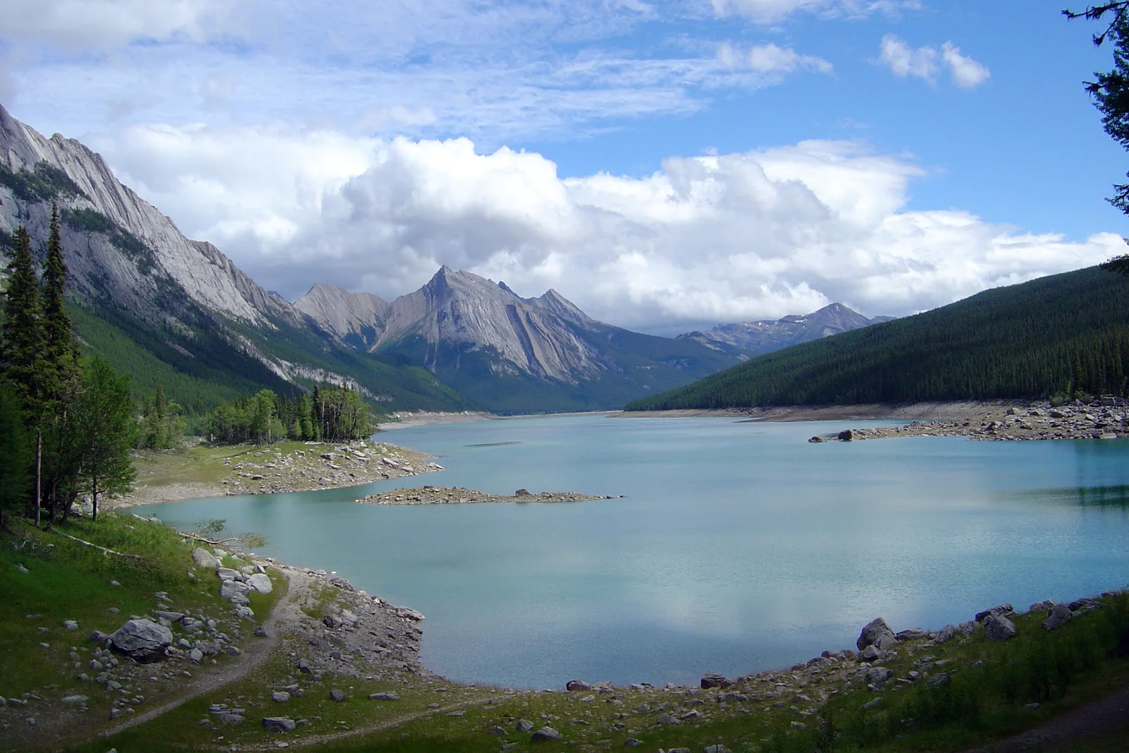 Medicine Lake in Jasper National Park on Maligne Lake Road between forested mountains