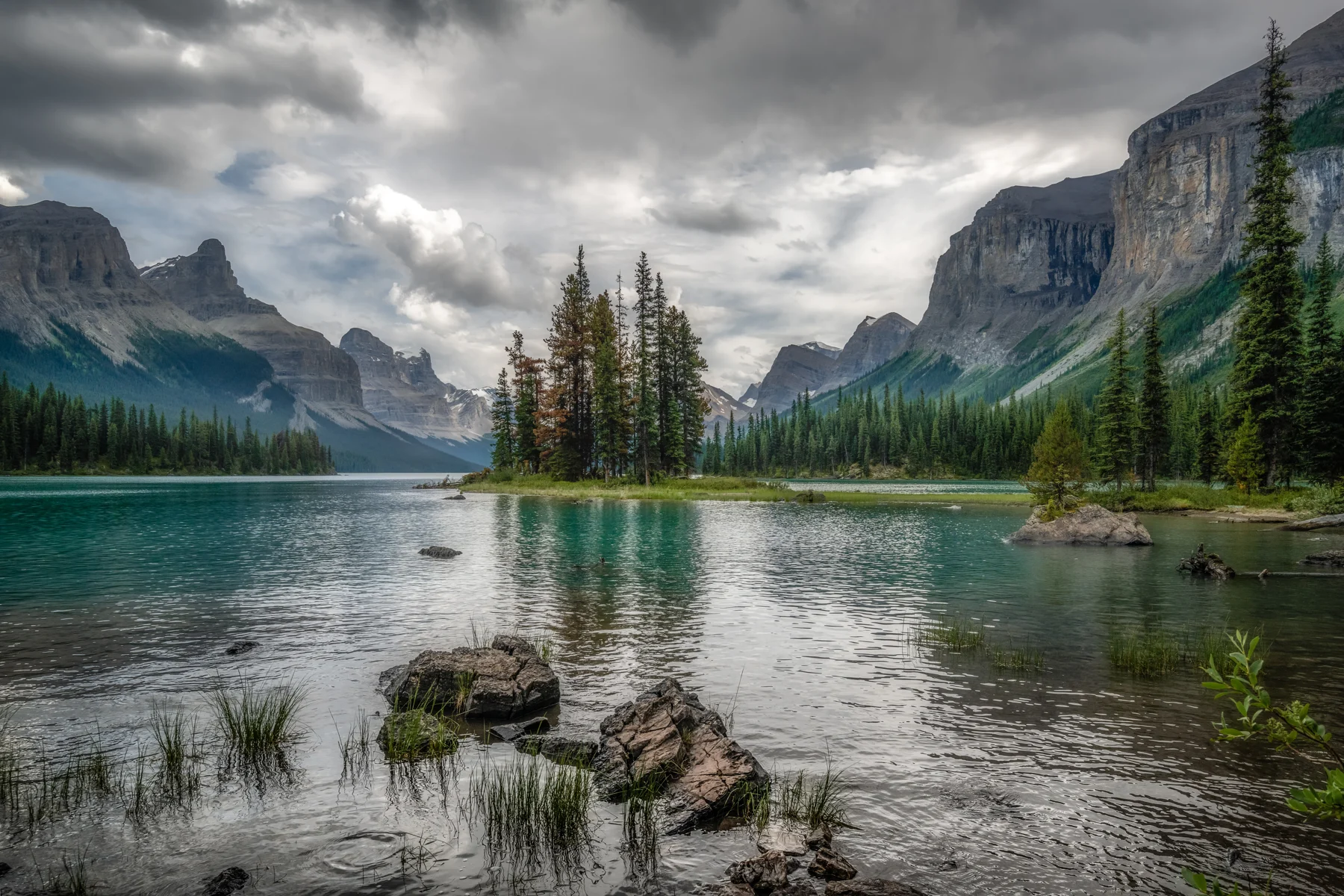 Spirit Island in Maligne Lake below the mountains of Jasper National Park