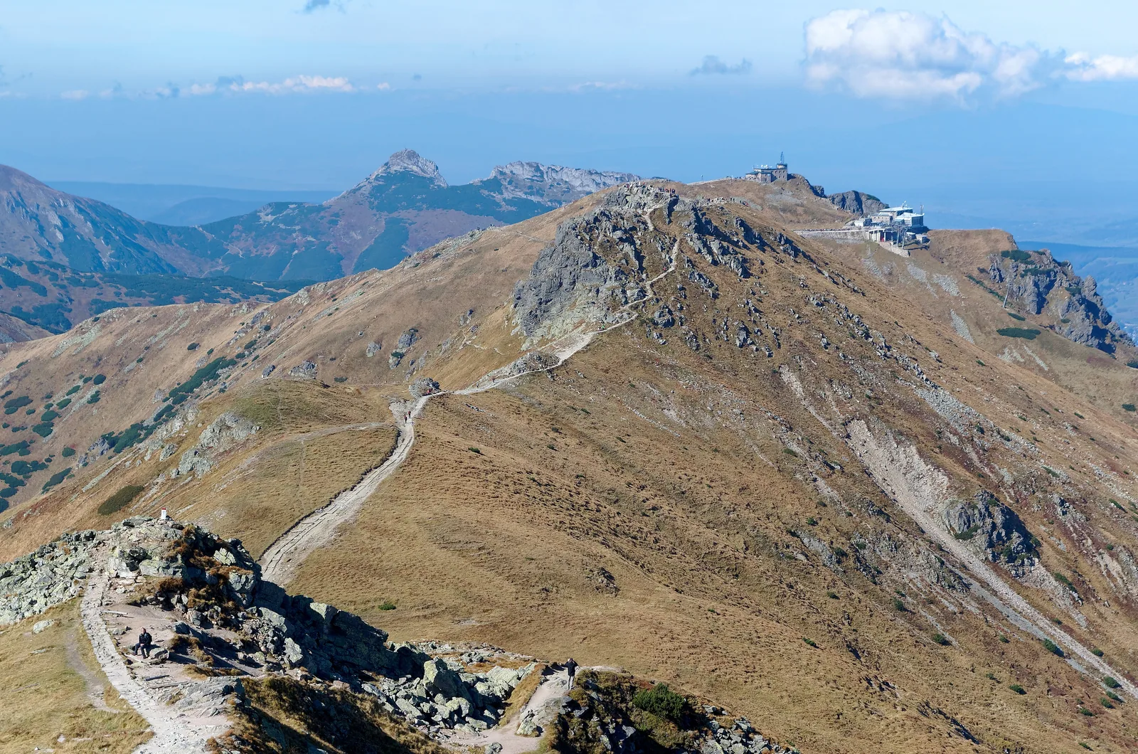 View from the Liliowe pass over Beskid to Kasprowy Wierch with the cable car top station, brown autumn slopes in Tatra National Park