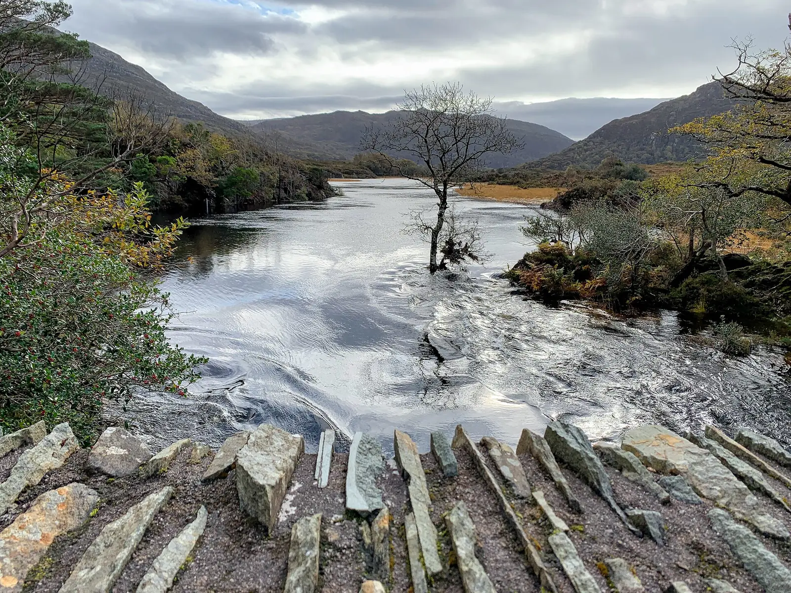 View from the Old Weir Bridge across the Meeting of the Waters in Killarney National Park towards Torc