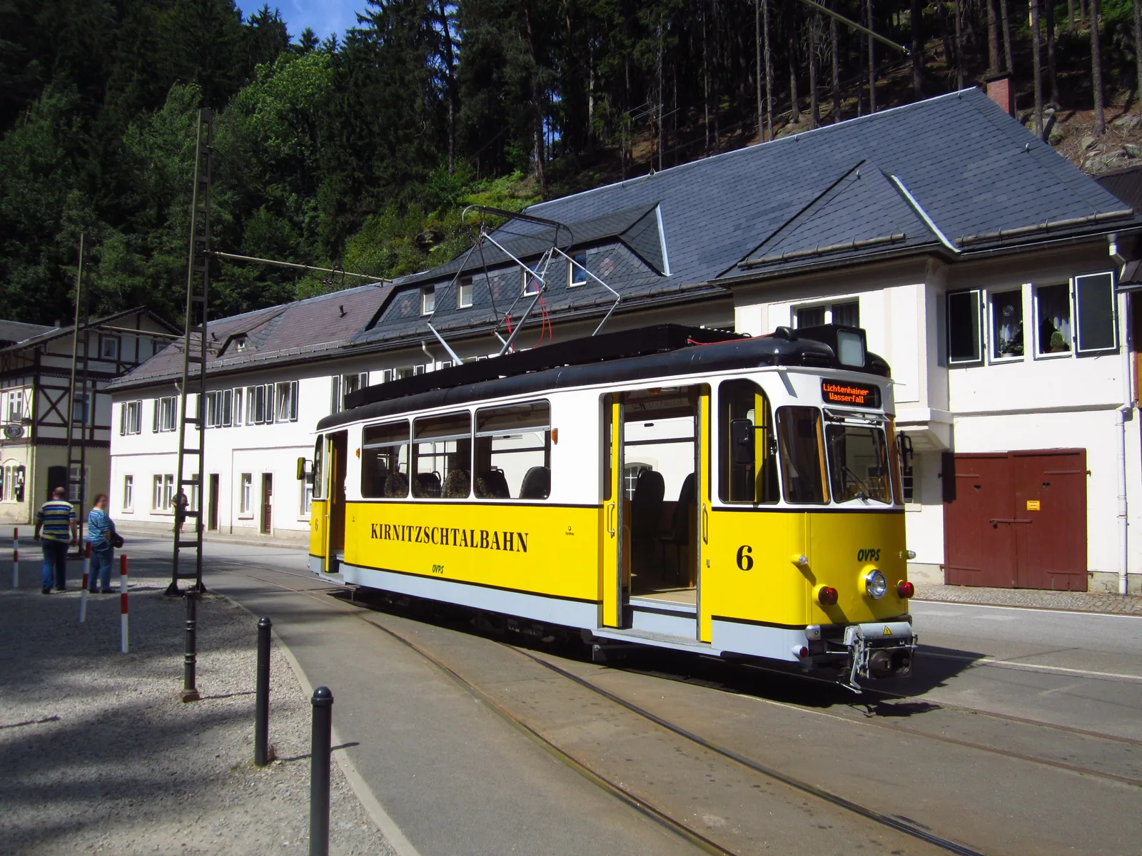 Yellow Kirnitzschtal tram car 6 at a stop on the line through the Kirnitzschtal valley