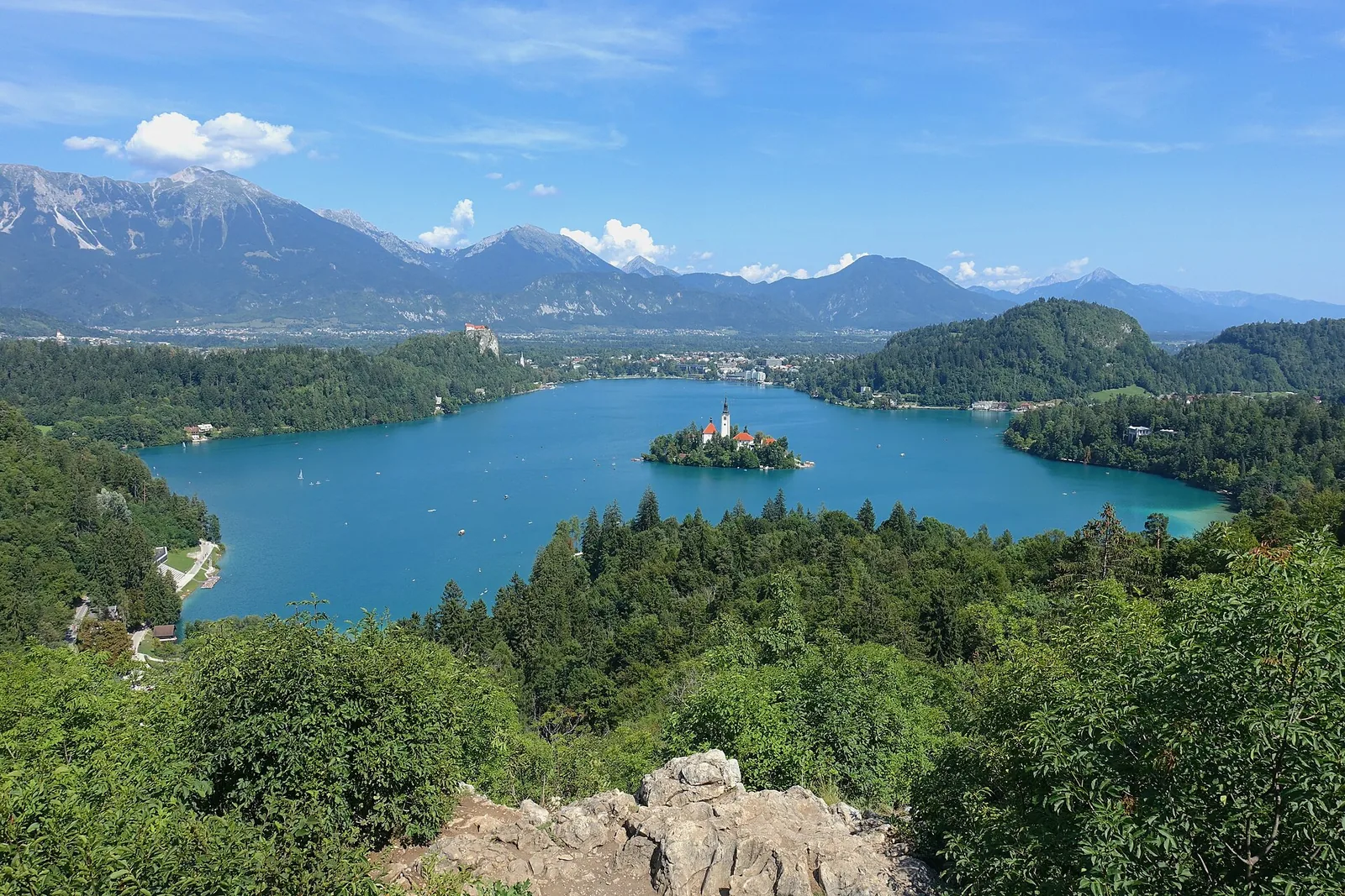 Lake Bled seen from Ojstrica, with Bled Island and its pilgrimage church, and the Julian Alps of Triglav National Park behind