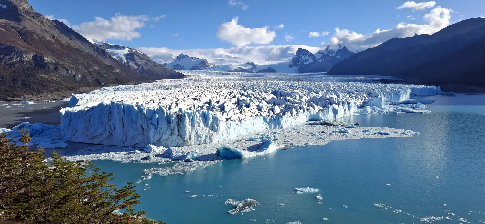 Perito Moreno Glacier in Los Glaciares National Park seen from the walkways: a white ice front above Lago Argentino, snow-covered mountains behind