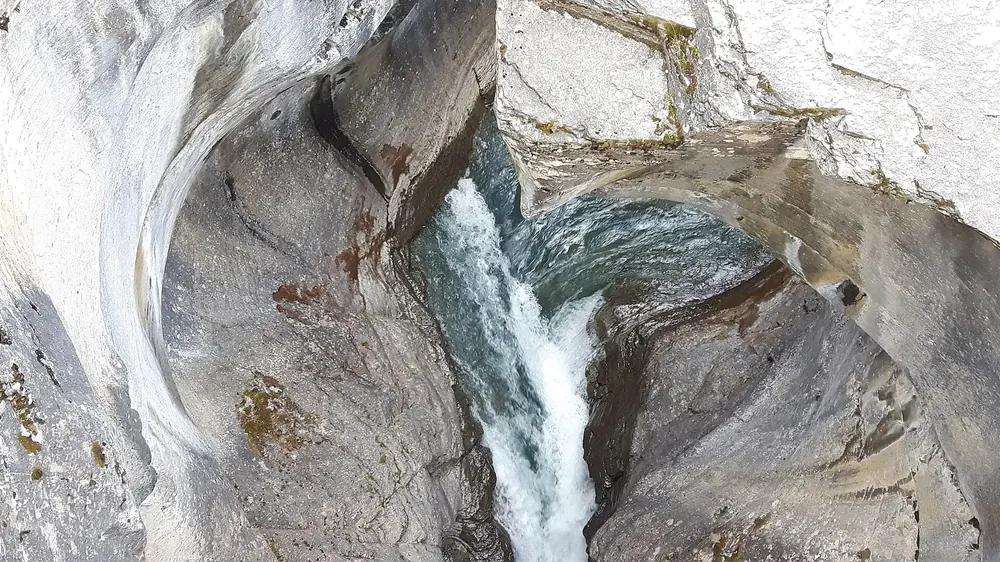 Mistaya Canyon in Banff National Park: water rushes through a deeply scoured, smoothly polished limestone gorge
