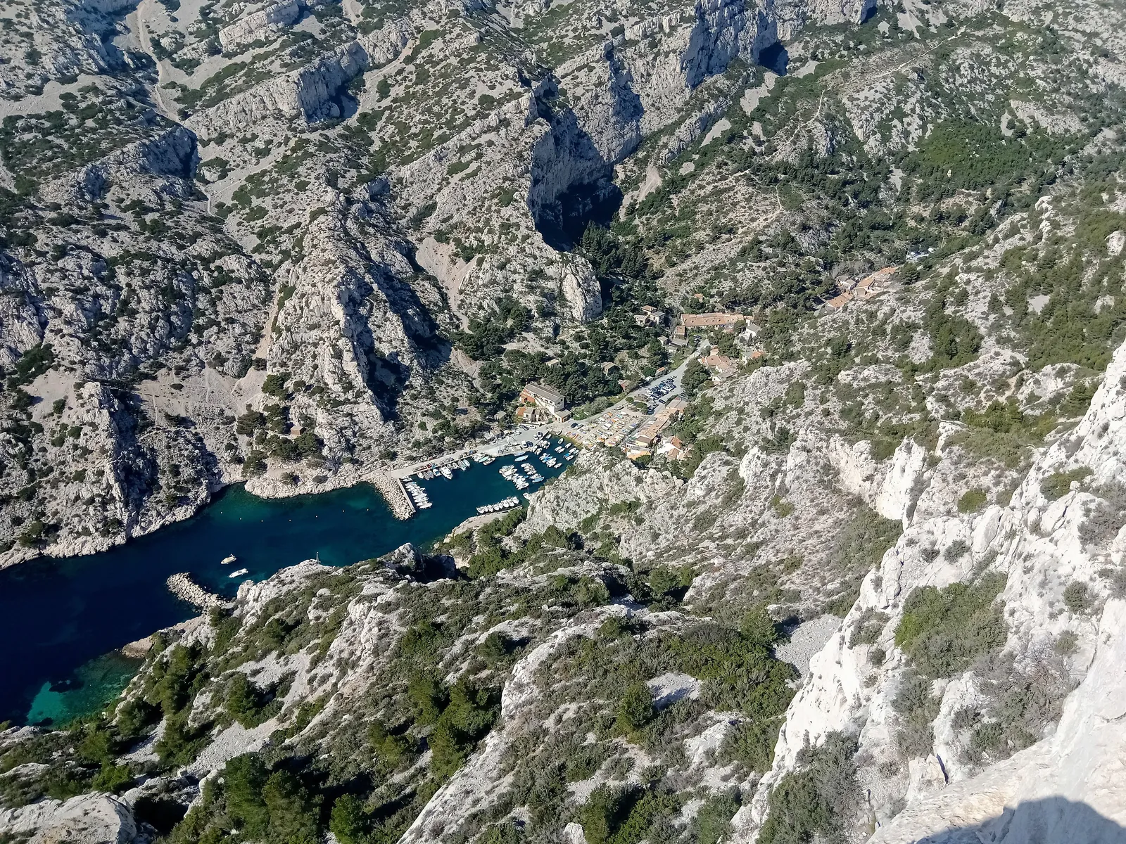 View from the Belvédère de Sugiton in Calanques National Park down to the Calanque de Morgiou between steep limestone walls