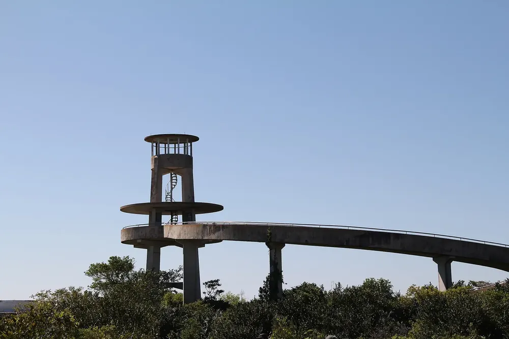 Observation tower in Shark Valley, Everglades National Park: round concrete tower with a spiral ramp above the flat marsh