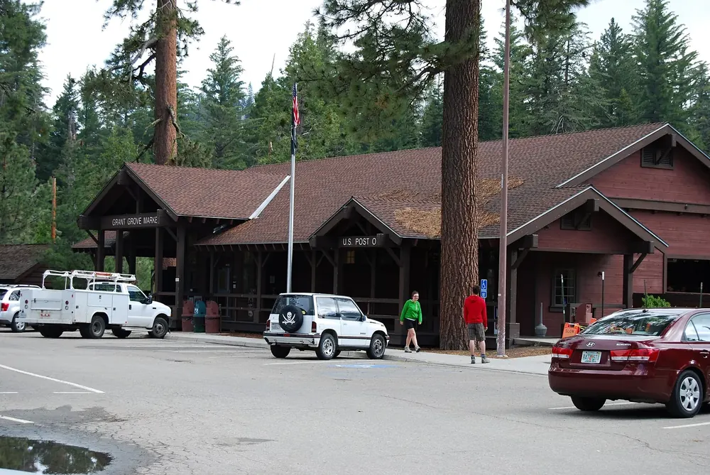 Grant Grove Market near the Kings Canyon Visitor Center in Kings Canyon National Park: rustic wooden building under giant sequoias, car park in front