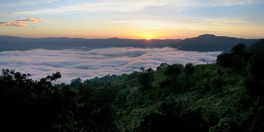 View from the Ngorongoro Serena Safari Lodge at dawn: a sea of clouds in the crater beneath the sunrise