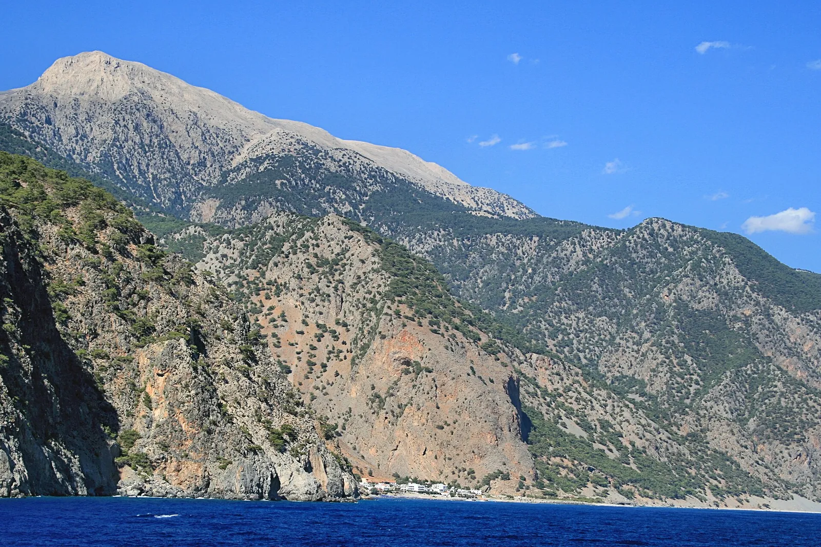 Agia Roumeli at the mouth of the Samaria Gorge, seen from the ferry, below the slopes of the White Mountains