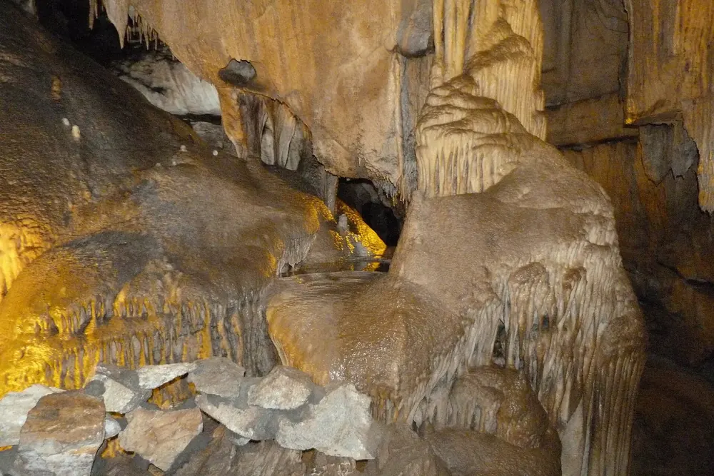 Crystal Cave in Sequoia National Park: limestone cave with stalactites and flowstone formations in warm light