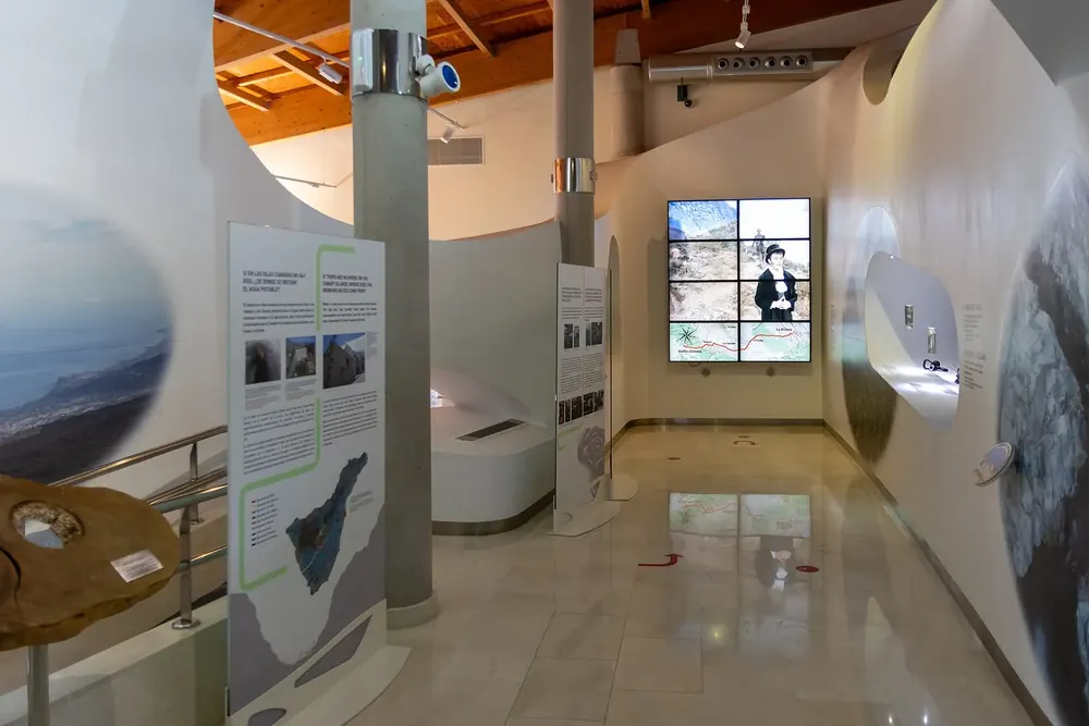 Exhibition room in the Telesforo Bravo visitor centre: information panels, screens and display cases on Teide's volcanic landscape