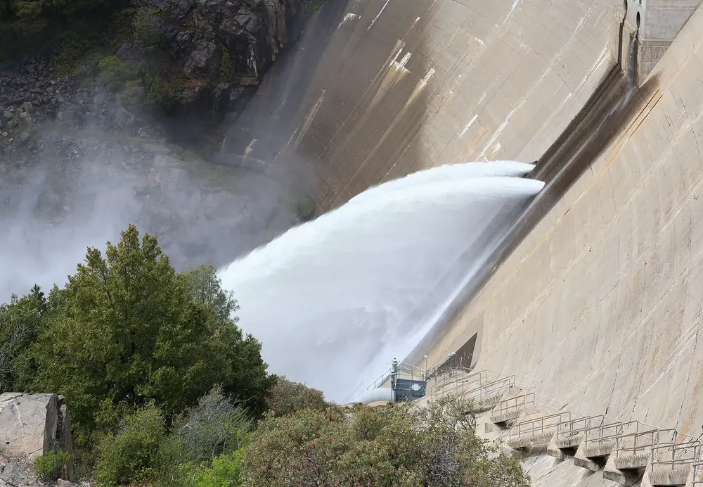 O’Shaughnessy Dam: water shoots from the concrete dam of Hetch Hetchy Reservoir into the valley