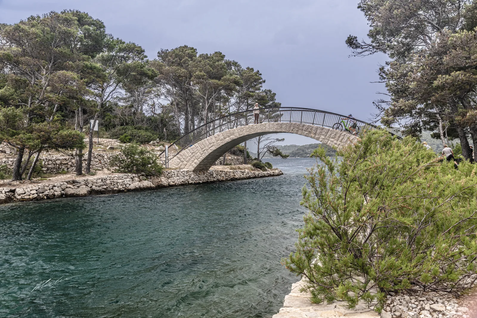 Stone bridge over the narrow channel between the two lakes in Mljet National Park