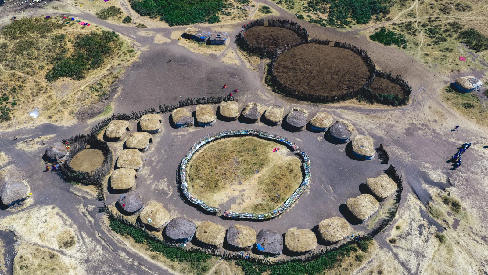 A circular Maasai homestead from the air, huts in a ring around the cattle enclosure