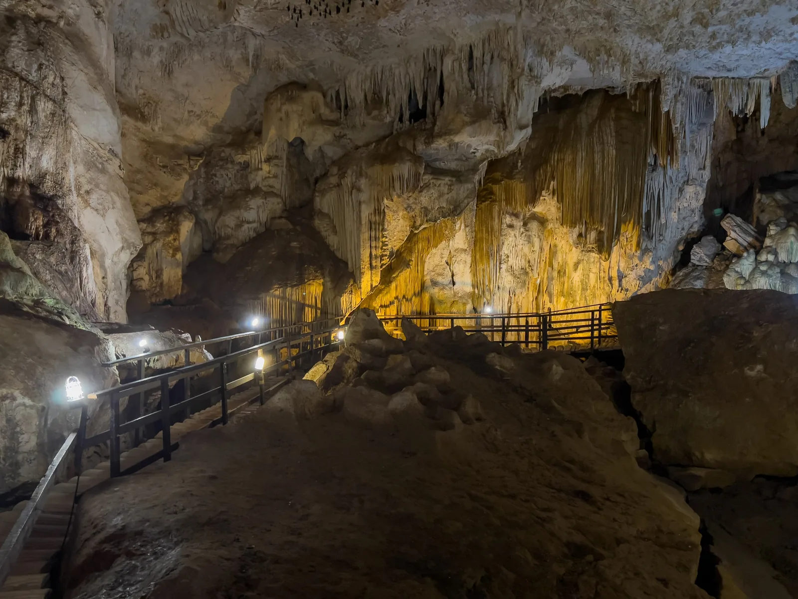 Lit wooden walkway in the Phra Nang Nai cave on the Railay peninsula in Hat Noppharat Thara–Mu Ko Phi Phi National Park