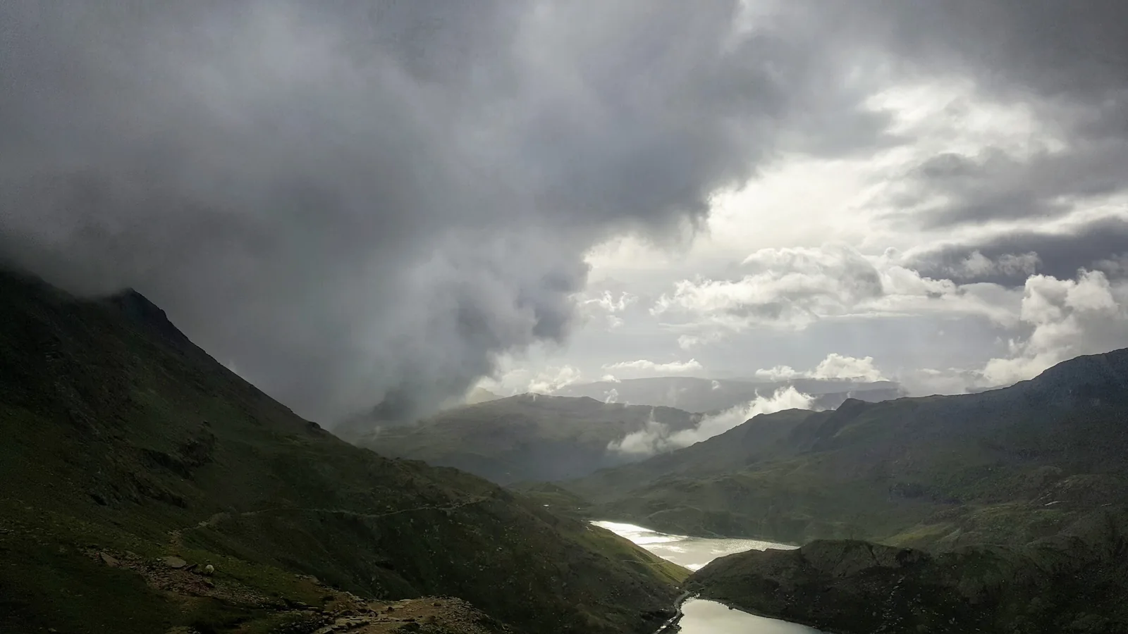 Dark clouds over the lakes Glaslyn and Llyn Llydaw on Snowdon in Snowdonia National Park