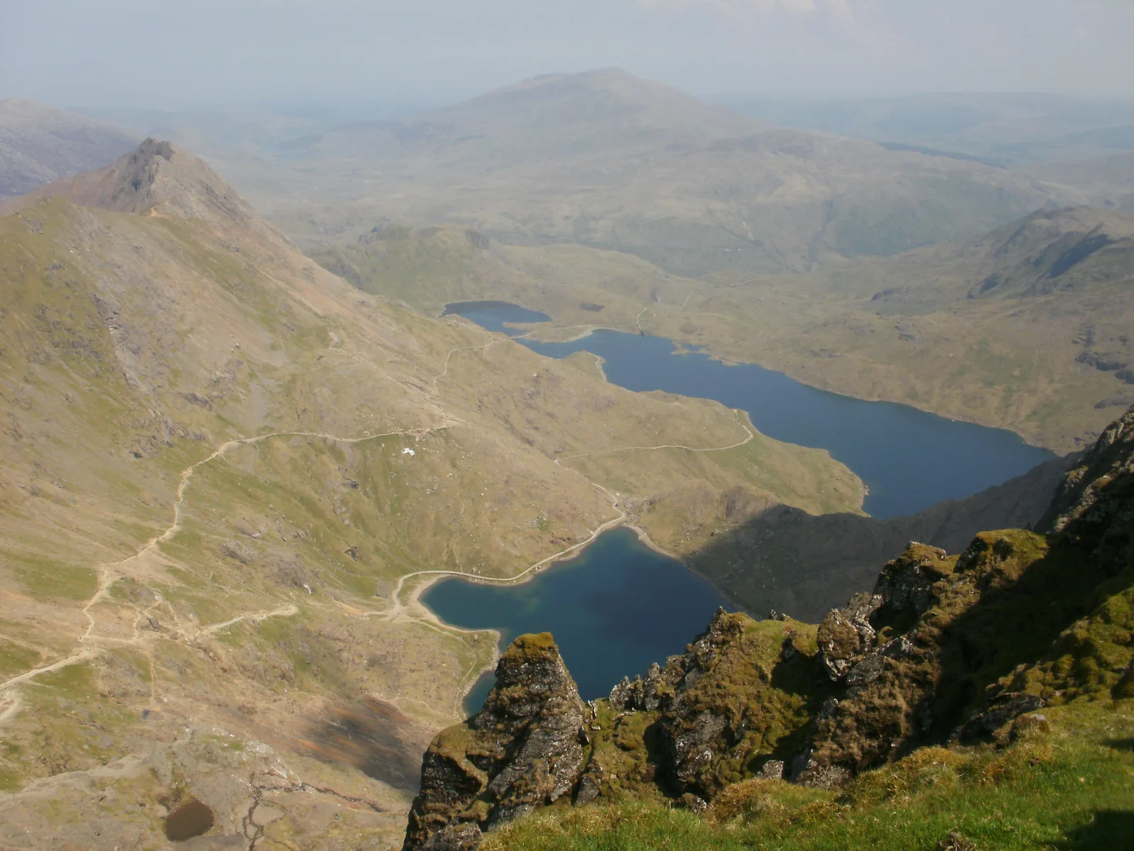 View from Snowdon in Snowdonia National Park down to the lakes Glaslyn and Llyn Llydaw and the paths in the valley