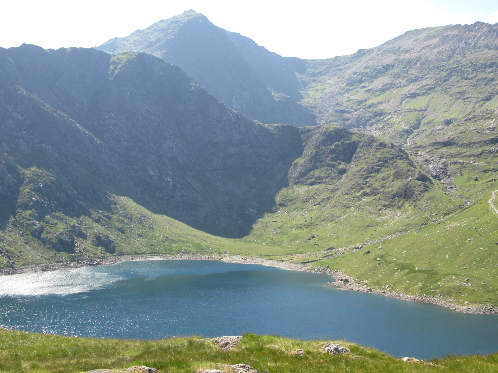 The lake Llyn Llydaw in Snowdonia National Park, with the pointed summit of Snowdon (Yr Wyddfa) above