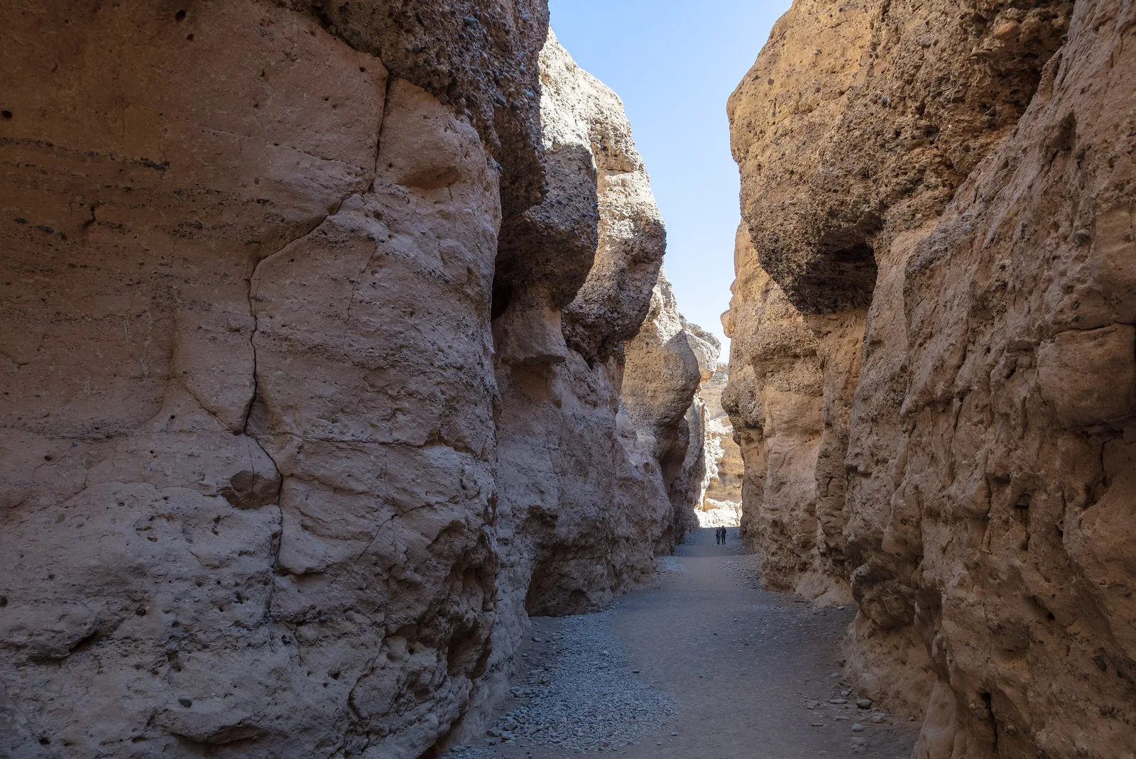 Steep conglomerate walls in Sesriem Canyon in Namib-Naukluft National Park, a dry riverbed at the bottom