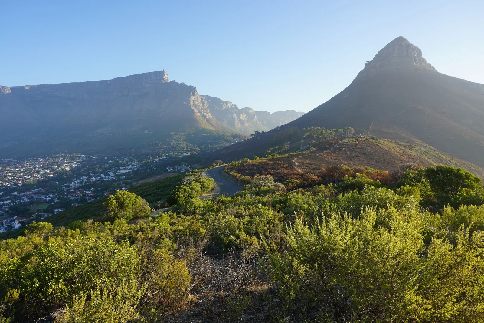 The pointed Lion’s Head in Table Mountain National Park seen from Signal Hill, with flat-topped Table Mountain behind it to the left above the city
