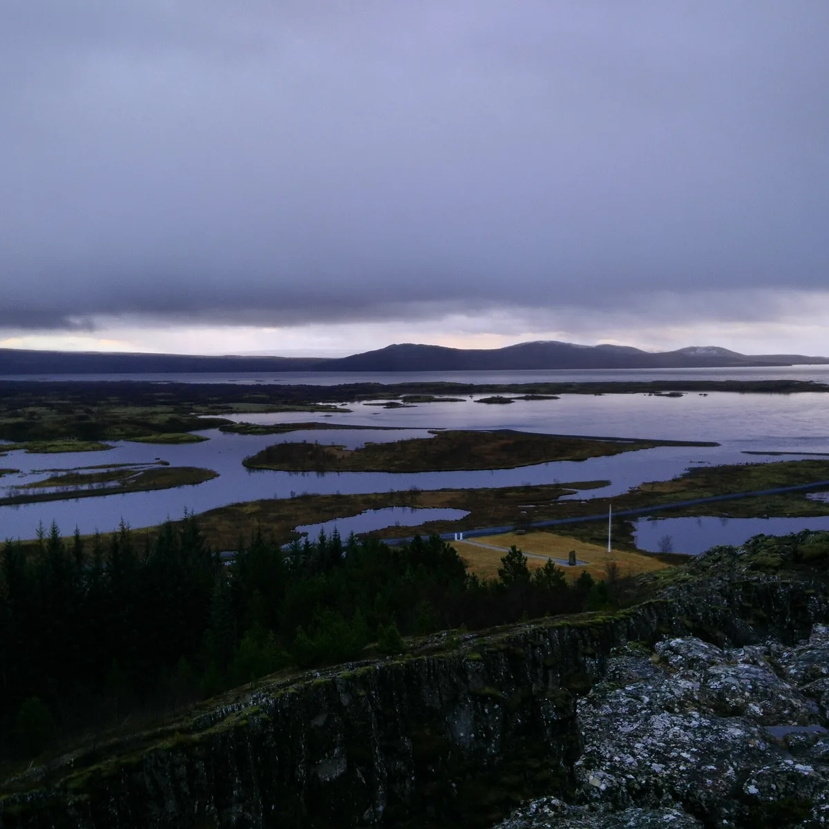 View over Almannagjá to Þingvallavatn in Þingvellir National Park under low clouds