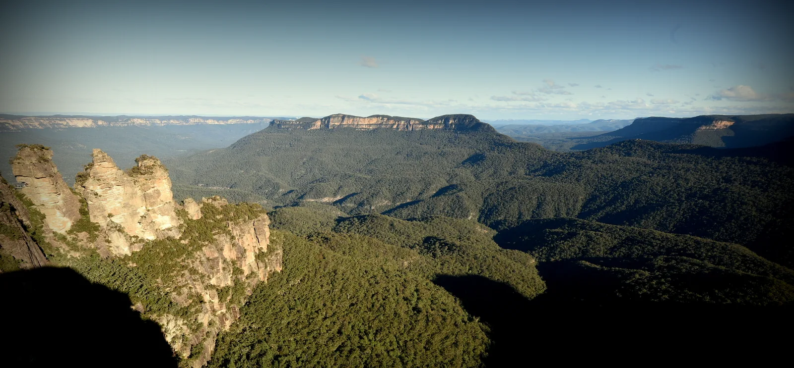 The Three Sisters in Blue Mountains National Park in the light, with the Jamison Valley and Mount Solitary behind