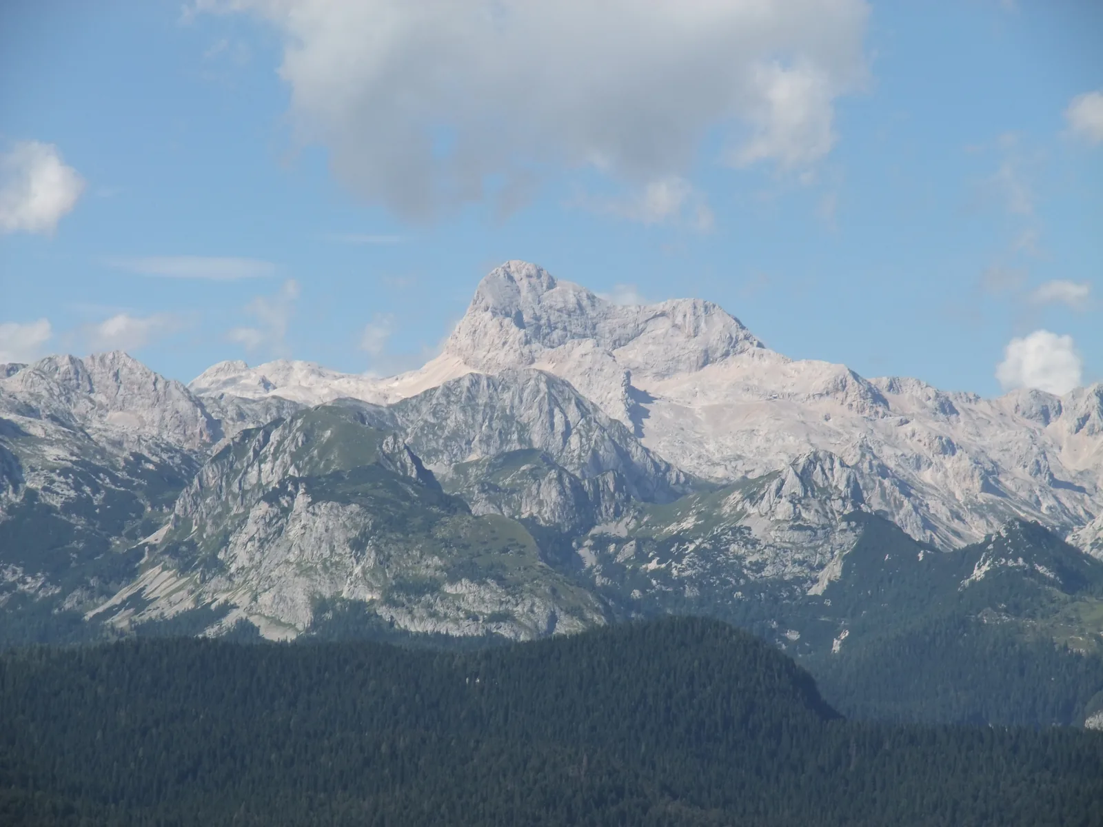 Triglav in Triglav National Park, with its broad summit block above the limestone ridges of the Julian Alps, seen from Vogel above Lake Bohinj