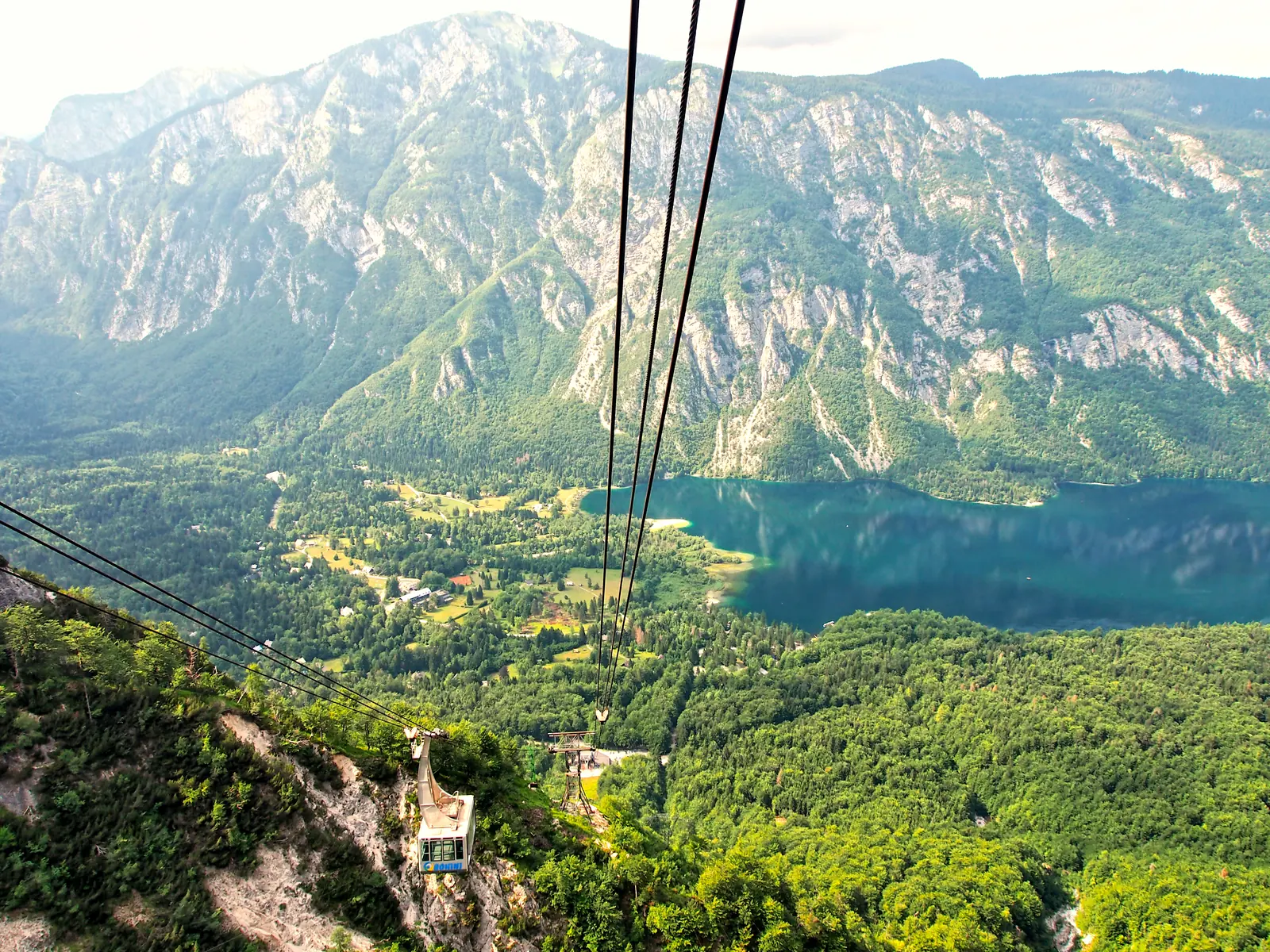 View from the Vogel cable car in Triglav National Park: Lake Bohinj deep in the wooded valley