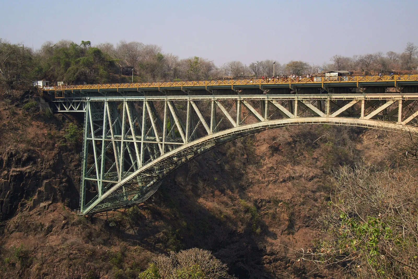 The steel arch of Victoria Falls Bridge spans the Batoka Gorge between Zimbabwe and Zambia