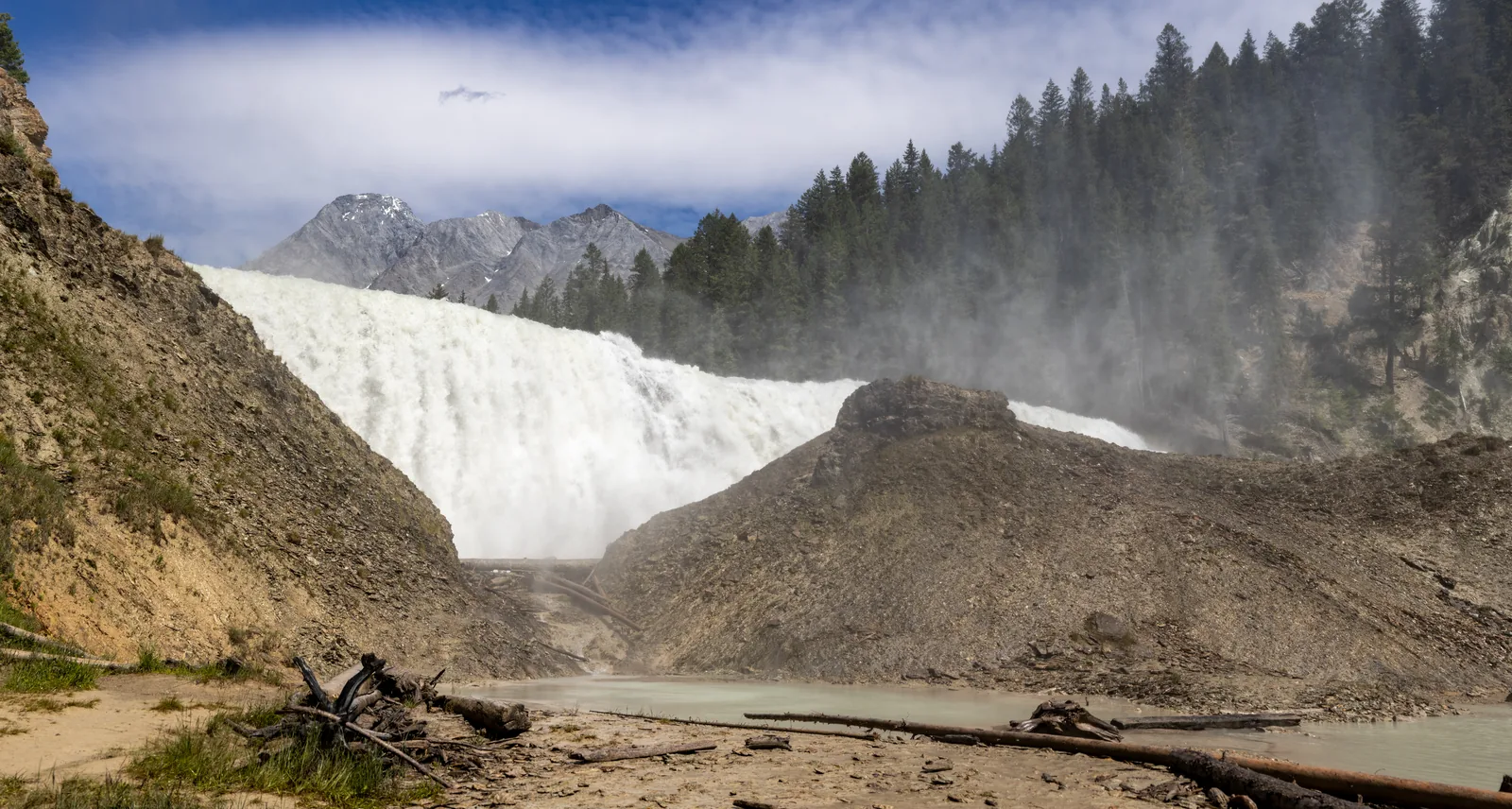 The wide Wapta Falls in Yoho National Park plunging over the rock step in a cloud of spray