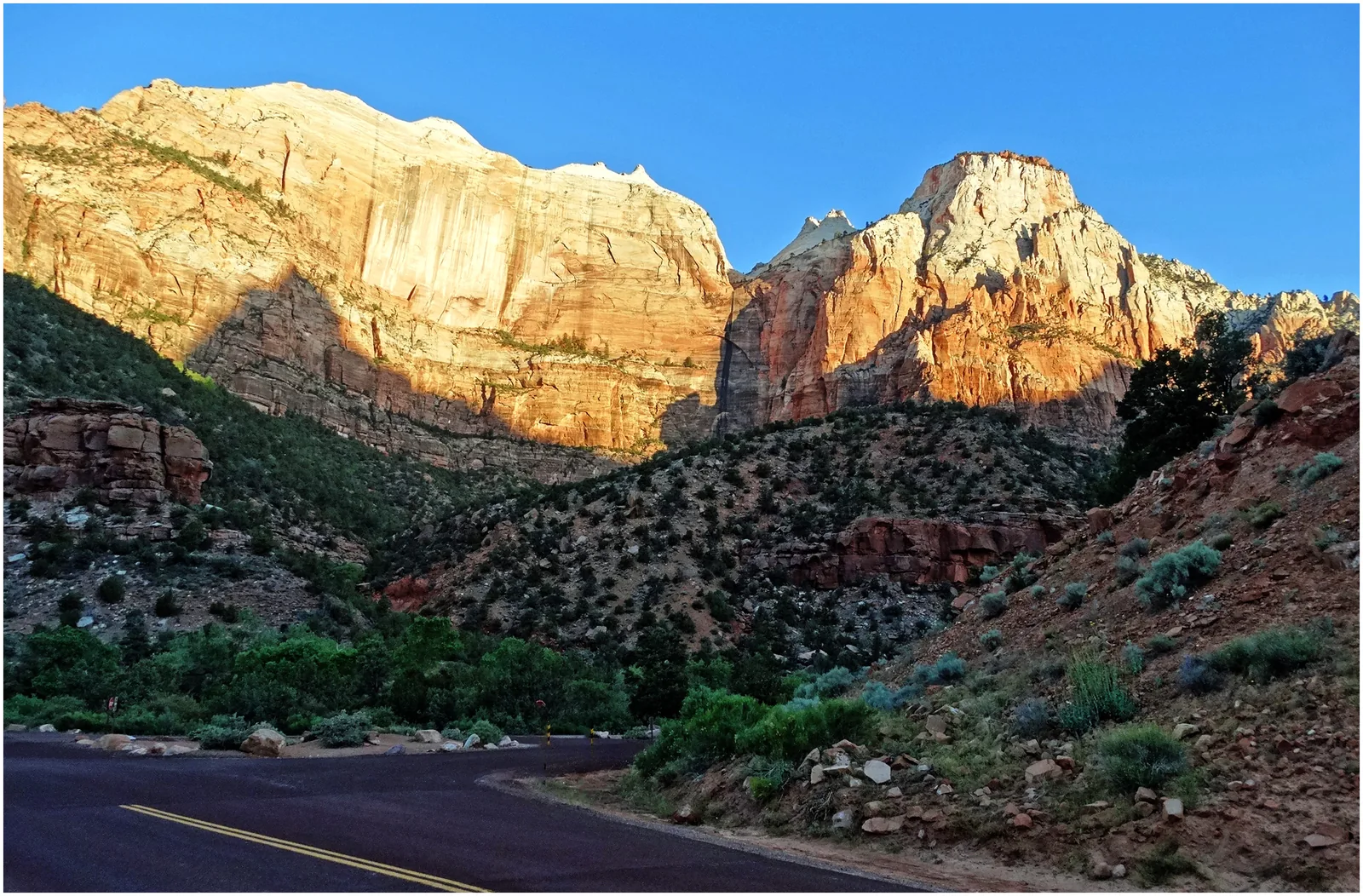 First morning light on the sandstone walls at Canyon Junction in Zion National Park.